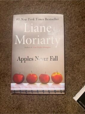 Liane Moriarty "Apples Never Fall" Hardcover Book - Cream & Red Cover